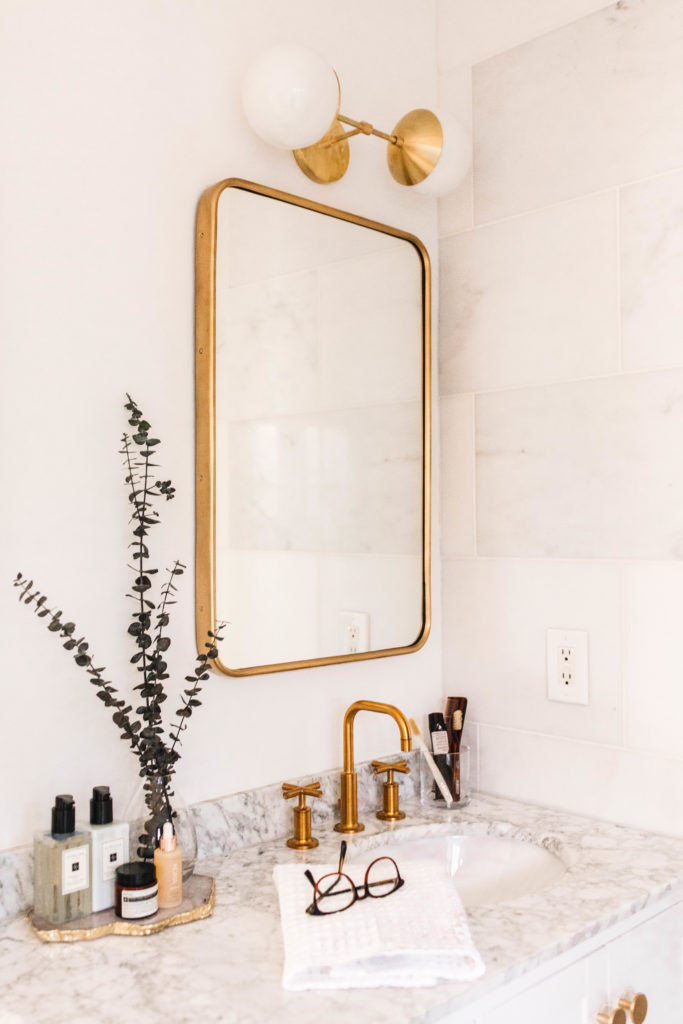 Brass Bathroom Mirror and Marble